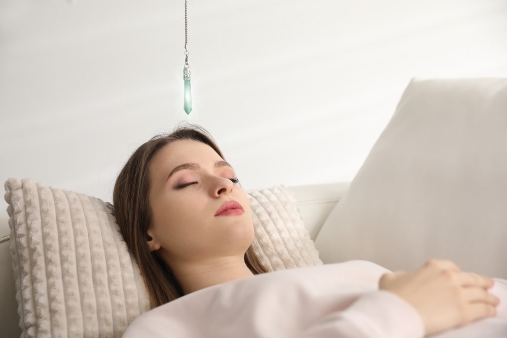 Patient on sofa during hypnotherapy session in office